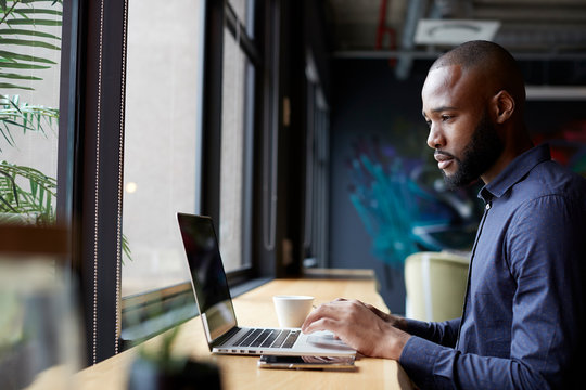 Man browsing on laptop