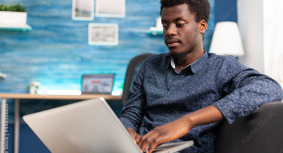 Man typing on modern laptop