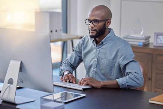 Man using Laptop on Desk