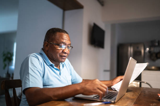 Old man using laptop