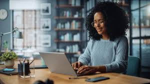 Woman using NTSA portal on laptop